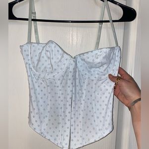 UO baby blue corset top with polka dots, front eyelet closure and adjustable